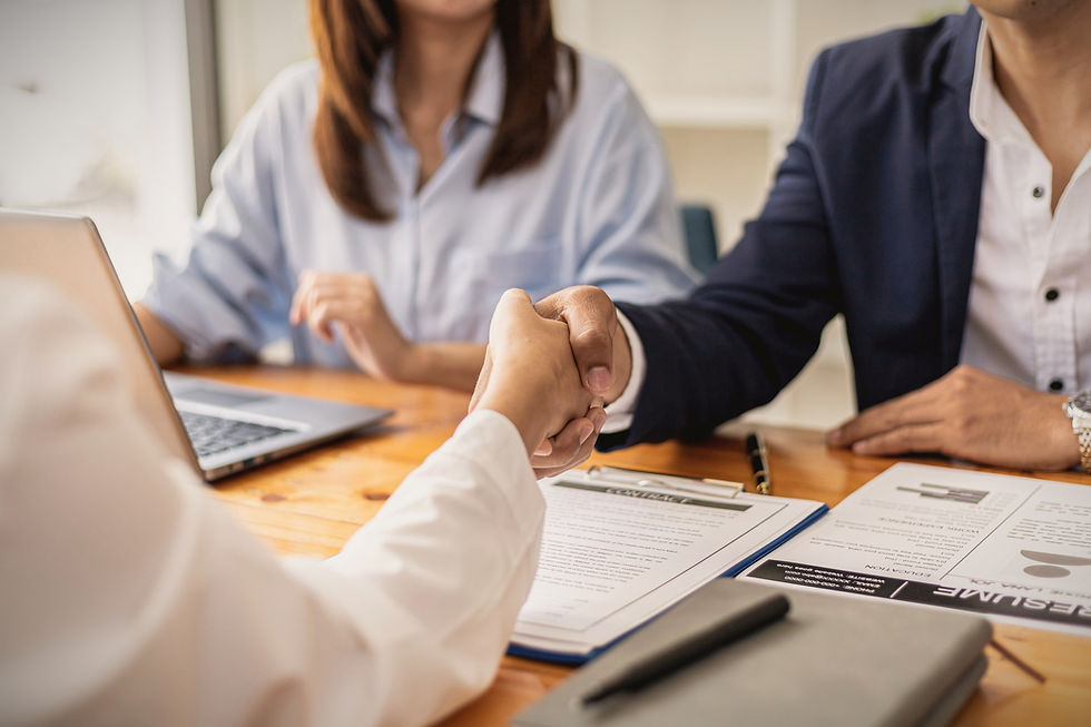 interviewing a young person for a job shaking hands